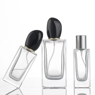 স্কয়ার গ্লাস পারফিউম বোতল 50ml 100ml ক্যাপাসিটি এবং স্বতন্ত্র অনিয়মিত আকৃতির ক্যাপ